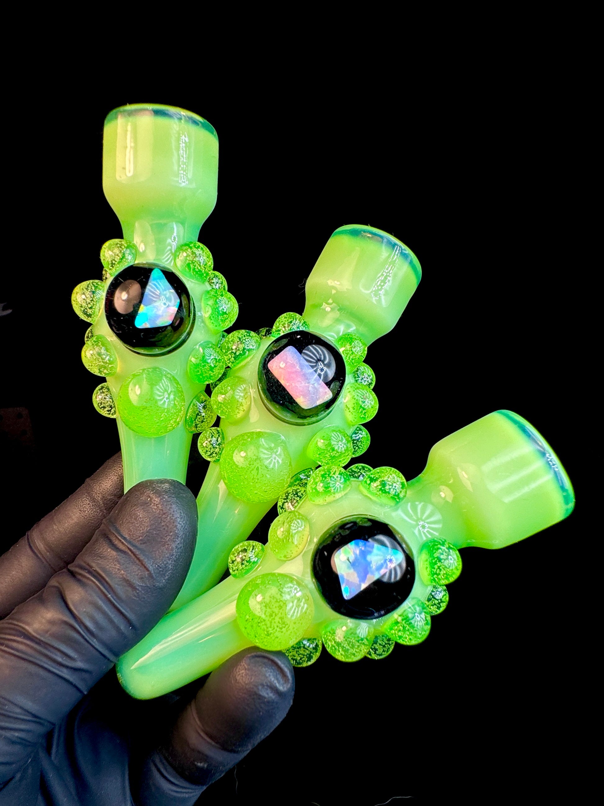 Three examples of Slyme green glass chillum with an opal and Slyme green dots