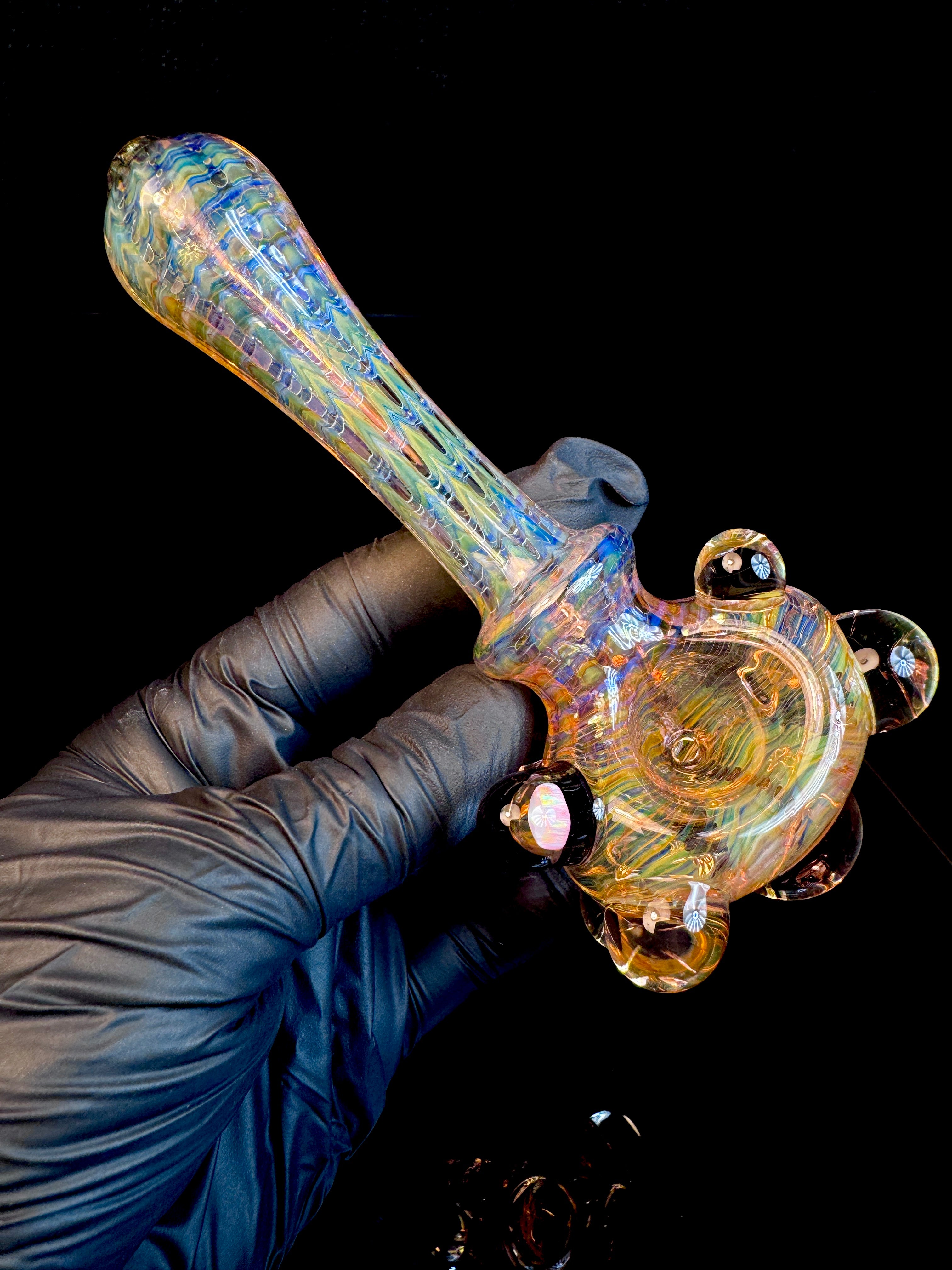 Golden dark web opal pipe